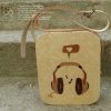 Wooden bag with a headphones marquetrie motif